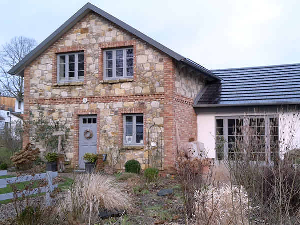 Bewertung Hausbau englisches Cottage aus verschiedenen Materialien in Escheburg